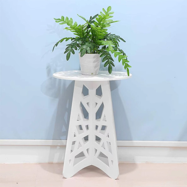 Стилна кръгла холна маса с ажурни крака и бял елегантен акцент 2