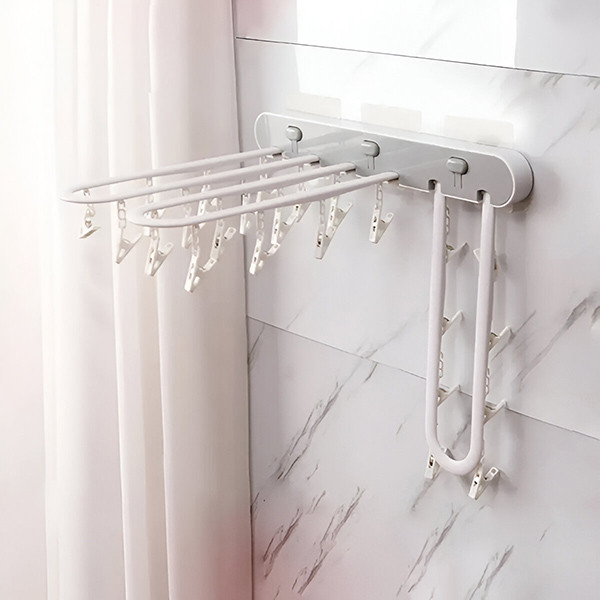 Самозалепваща се сгъваема стойка за сушене на дрехи с 24 щипки – компактно решение за малки пространства